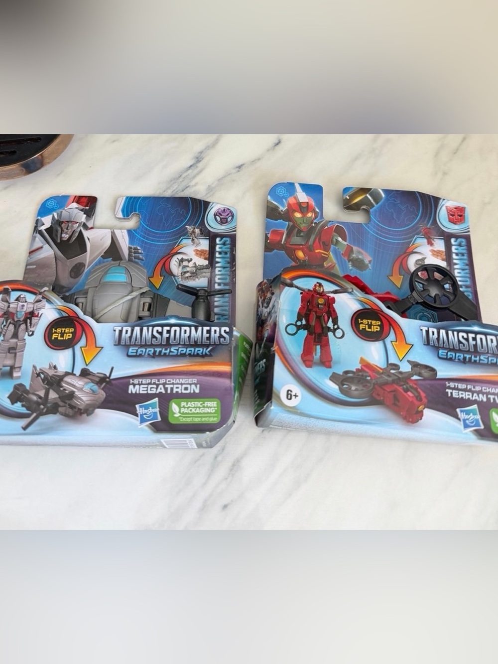 Two Transformers Earthspark Megatron and Terran Twitch1-Step Flip Changer